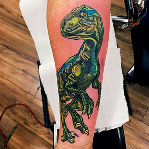 Blue the Dino 💙💚💛#jurassicpark #jurasicworld #blue #dino #dinosaur #colors #solidink #fkirons #tattoo #salem #oregon #neo #newschool #cute #colorful #forearm #prehistoric