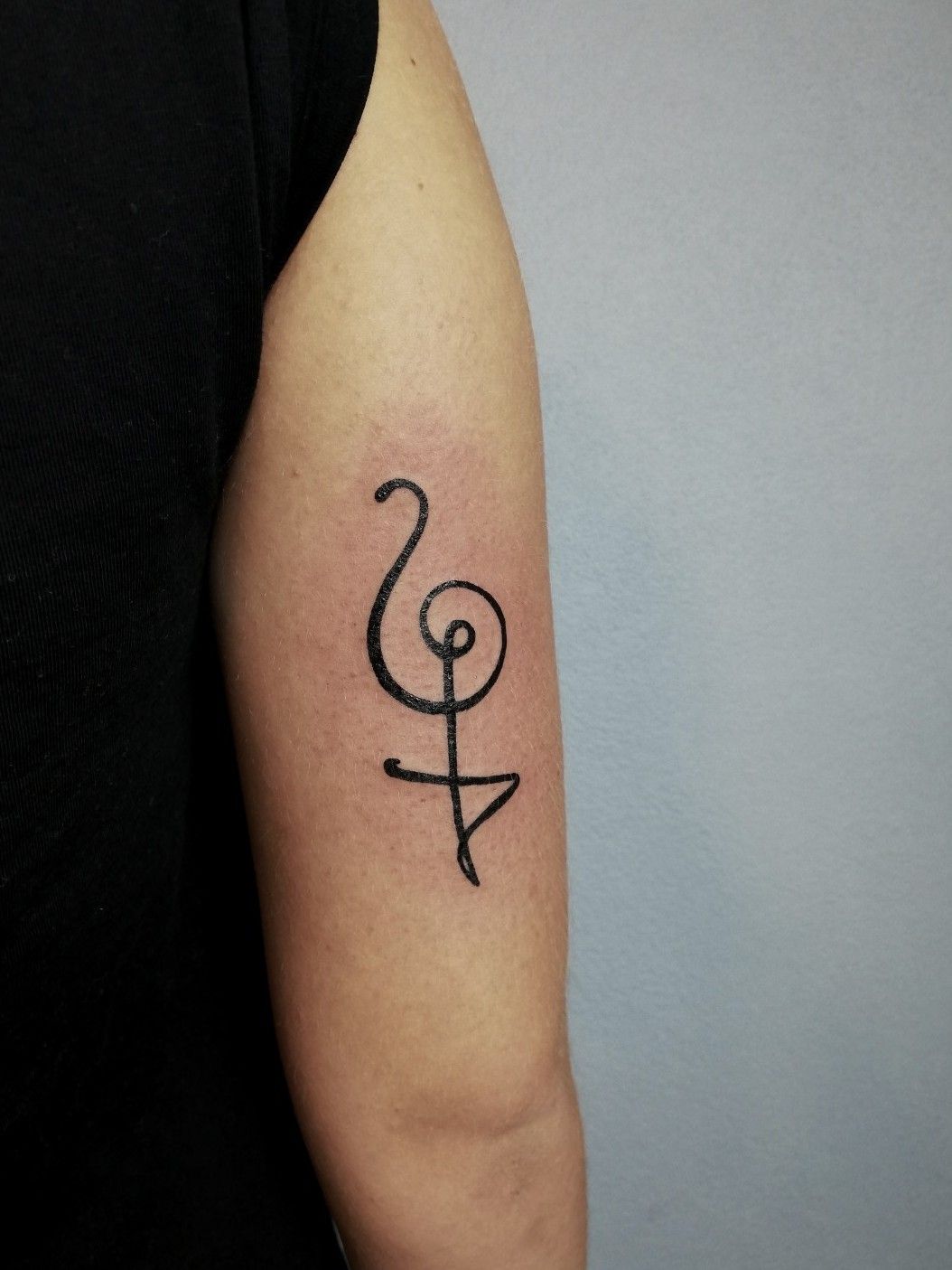 Hakuna Matata symbol tattoo located on the ankle