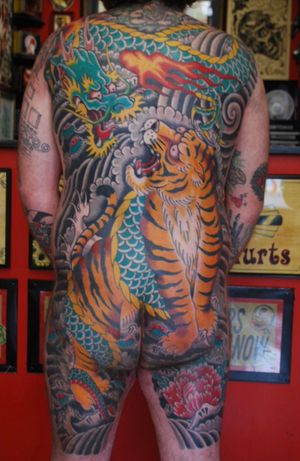 Dragon Tiger Full Japanese backpiece by @Tattootilt at Newlife Tattoos. Check out his book www.100backpieces.com