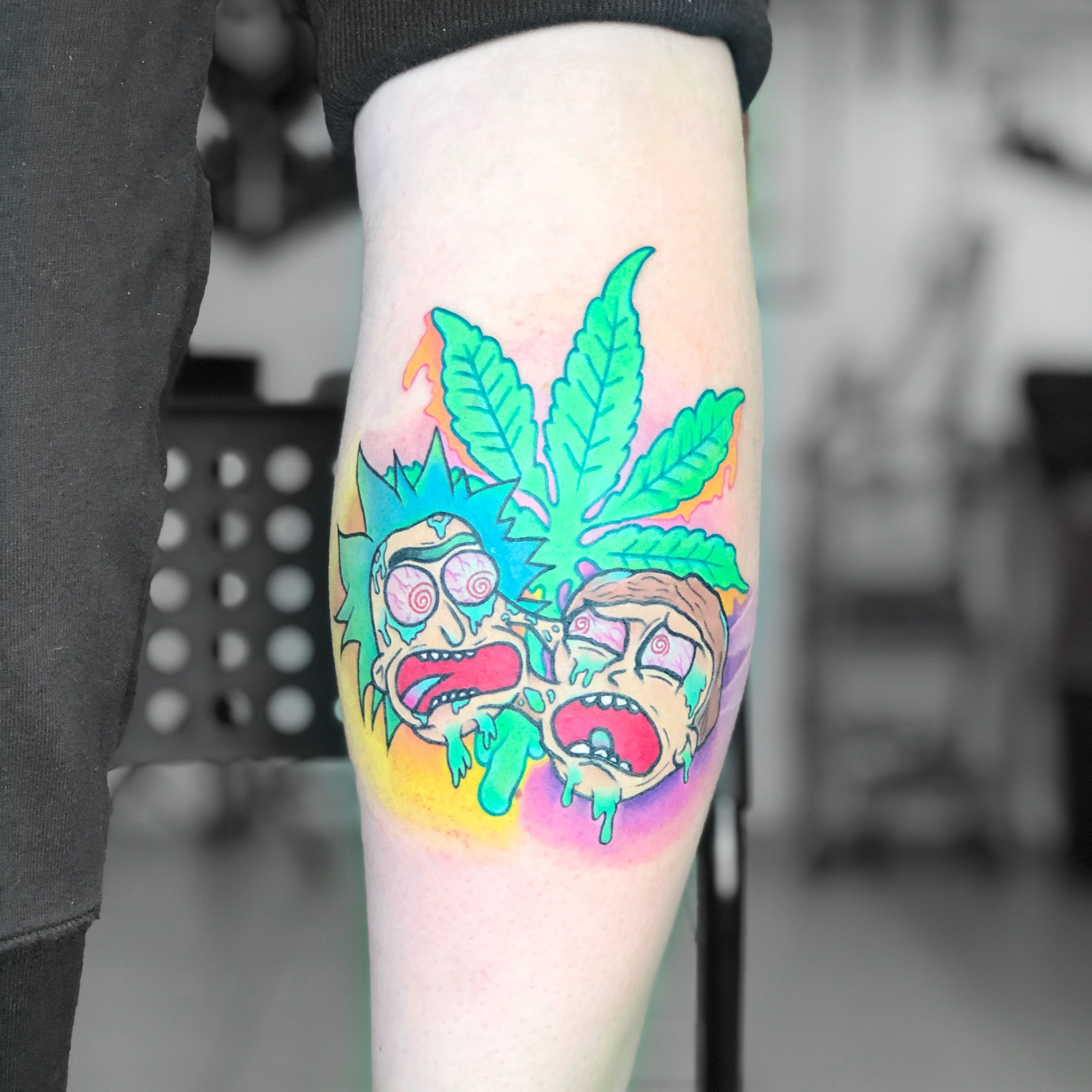 Rick and Morty tattoo on the thigh
