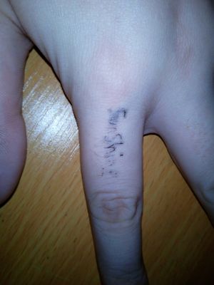 Finger stick and poke tattoo