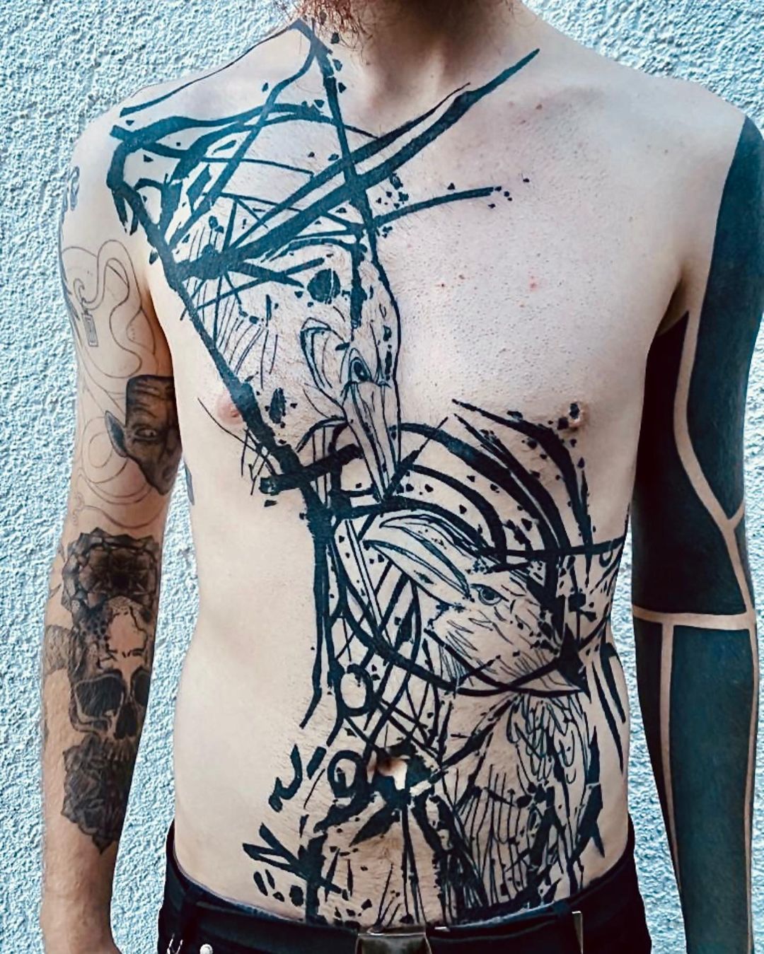 Ravens Abstract Chest Tattoo