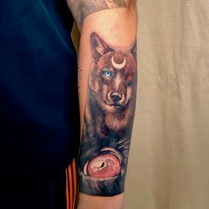 Wolf and wolf eye tattoo