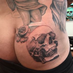 Work in progress skull and rose butt tattoo