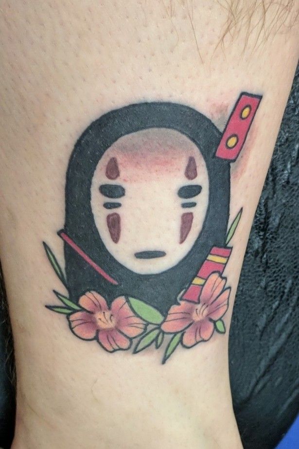 Spirited Away tattoo on the inner arm.