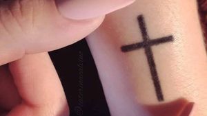 First tattoo. Left wrist. Minimal cross in existing scar.By Giacomo Linciano, Jack Tattoo (MI IT). 