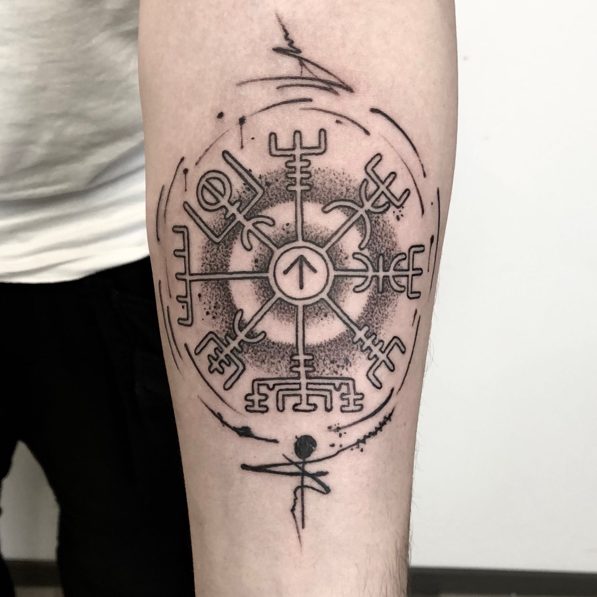 Compass tattoo on the upper arm
