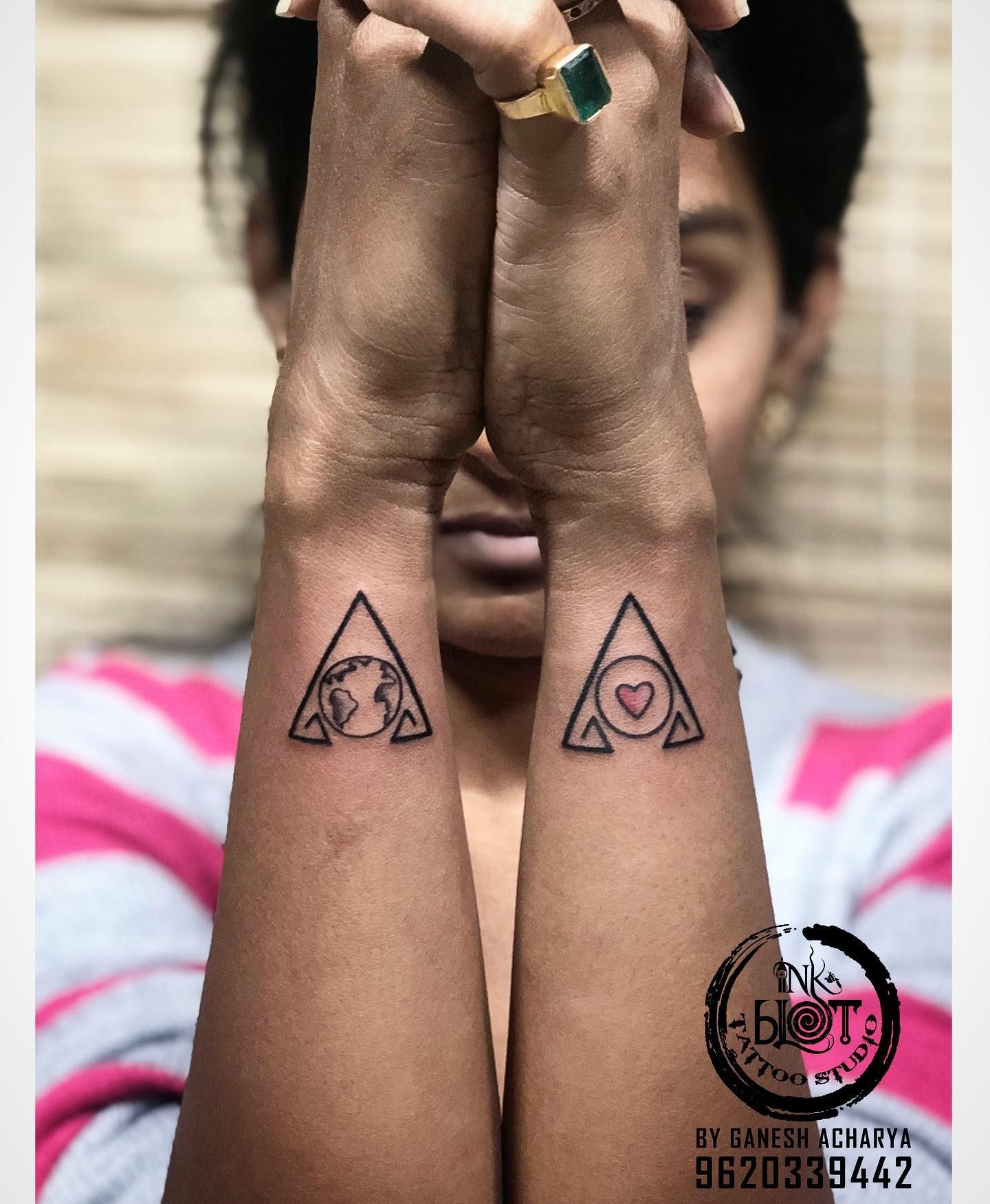 Minimalistic style triangle tattoo located on the