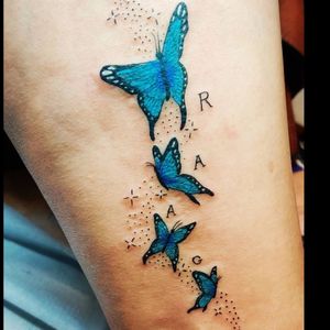 Bright blue butterflies with family initials.  
