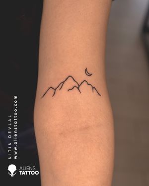 Mountain Tattoo by Nitin Devlal at  Aliens Tattoo India.Visit the link given below to see more small Tattoos here - https://www.alienstattoo.com/best-small-tattoo-ideas