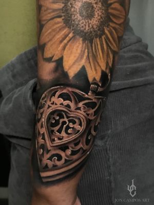 Black and grey locket tattoo done by Jon campos art. 