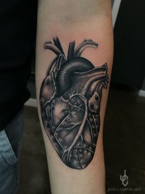 Iron heart anatomical mechanical heart black and grey tattoo done by Jon campos art Dallas, Tx. 