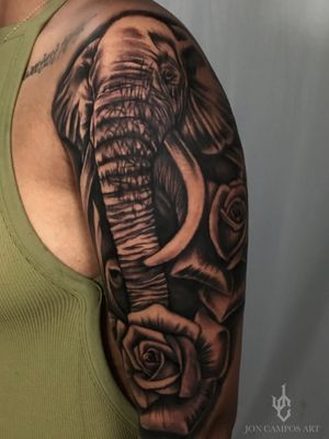 Elephant and roses half sleeve tattoo done by Jon campos art Arlington Tx. 