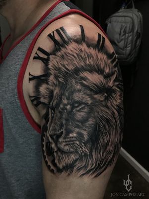black and grey lion and clock tattoo done by Jon campos art 