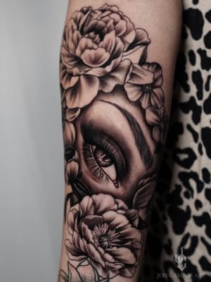 Woman’s eye and floral tattoo by Jon  campos art 