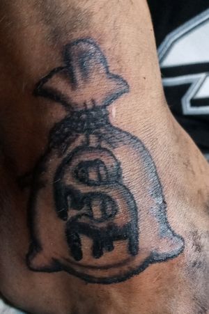 Moneybag tattoo/scar coverup