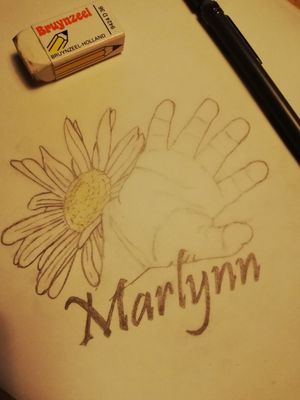 A design for a woman. It's the hand and name of her daughter. 