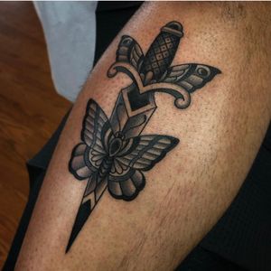 Black and grey butterfly and dagger on the shin