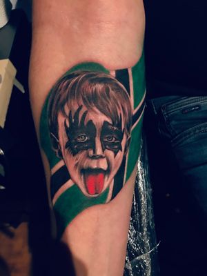 Kiss child portrait tattoo