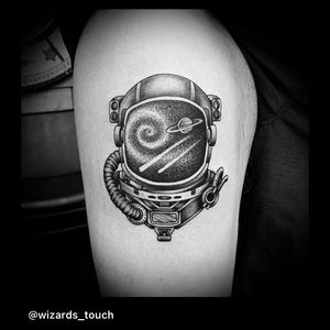 Explore the universe with this blackwork, dotwork, fine line tattoo featuring planets and astronauts on your upper arm in Miami.