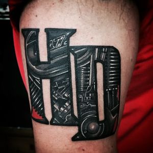 Get a badass blackwork motorcycle tattoo on your upper arm by a top artist in Miami, US. Rev up your style with this illustrative ink!