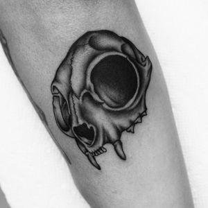Get a unique blackwork skull tattoo on your arm by the talented artist Miss Vampira. Stand out with this edgy design!
