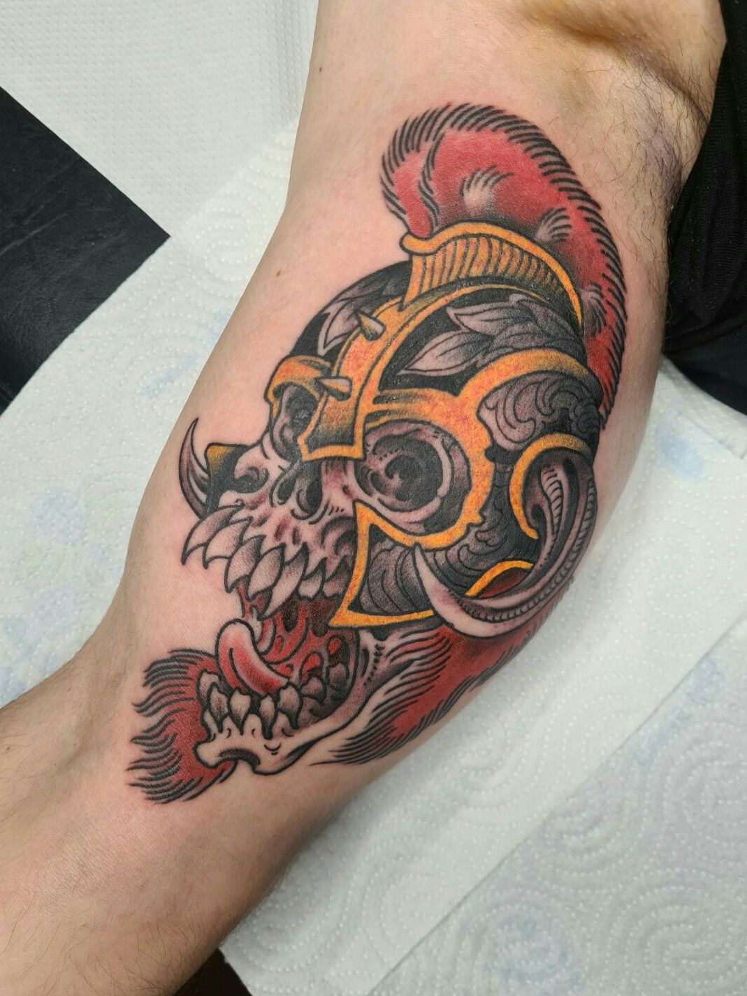 Firefighter tattoo with flames and a helmet tattoo idea | TattoosAI