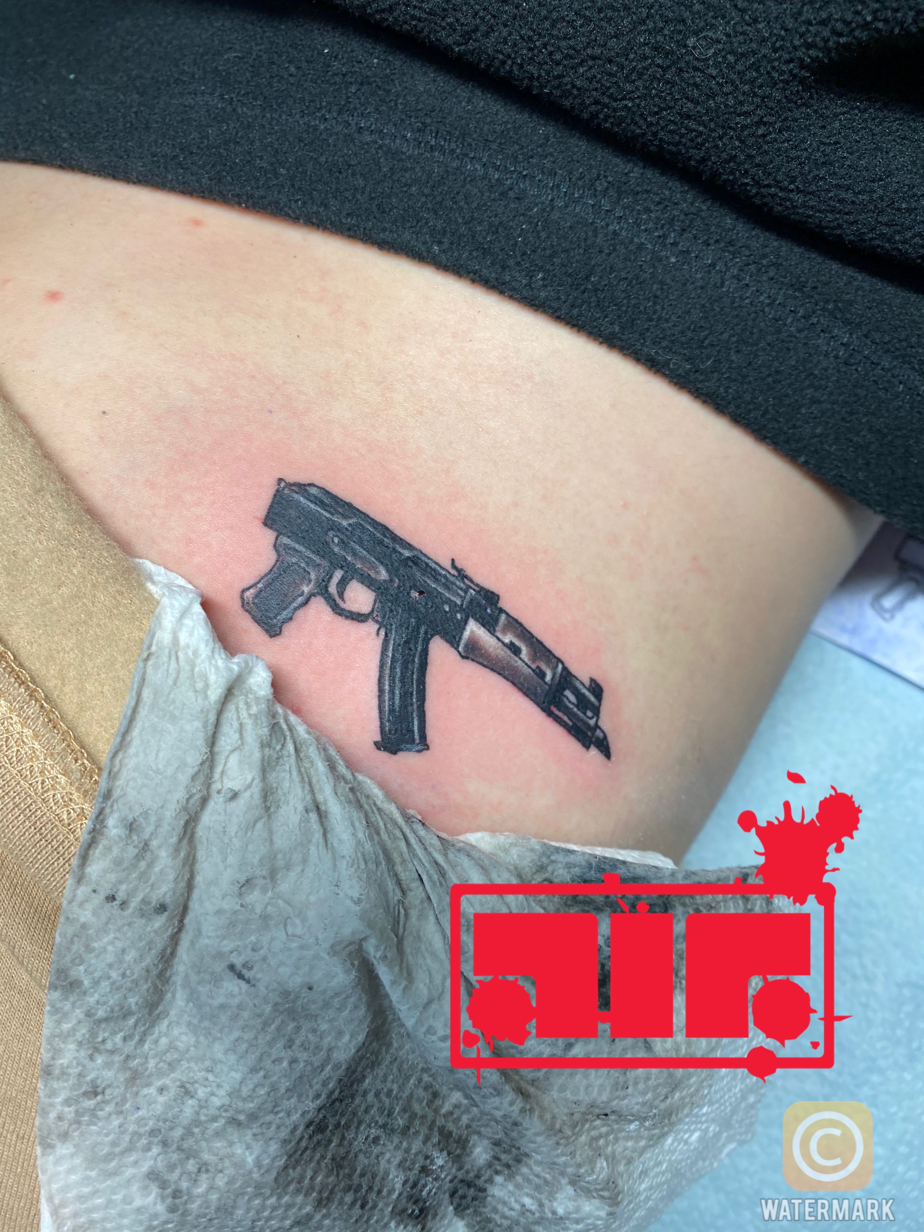 Molly Brazy Gun Bicep Tattoo  Steal Her Style