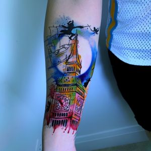 A stunning illustrative watercolor tattoo featuring a celestial scene with a moon, ship, clock, tower, and wizard, by Marcel Oliveira.
