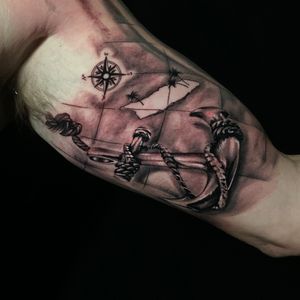 Anchor tattoo on upper arm done by Marcel Oliveira, showcasing stunning realism and intricate details.