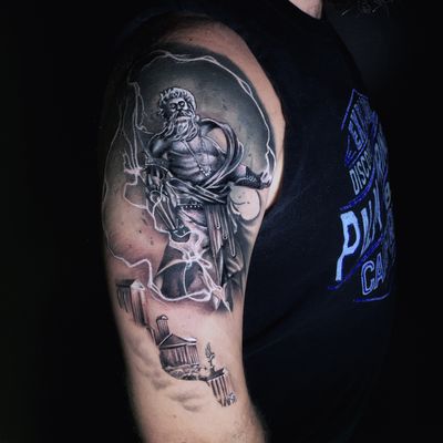 Experience the power and majesty of Zeus with this stunning black and gray upper arm tattoo by Marcel Oliveira. Realistic and illustrative design.