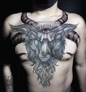 Get inked with a striking blackwork tattoo of a goat with horns by the talented artist Marcel Oliveira.