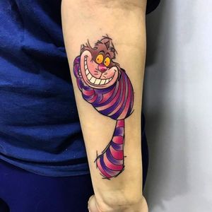 A vibrant new school tattoo of a playful cat on the forearm, expertly done by Marcel Oliveira.