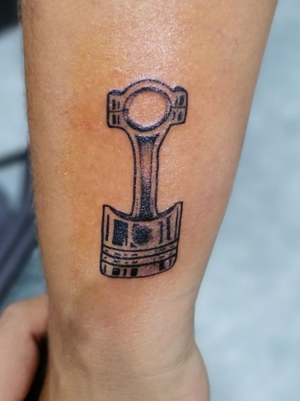 Tattoo of a piston and connecting rod on Craiyon