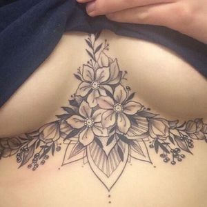 I love the lotus flower design under the breasts/ sternum. Hope to have this someday. 