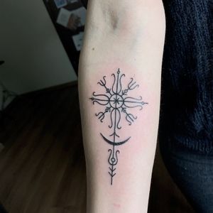 Custom baltic sun cross tattoo
