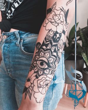 Hamsa and flower tattoo