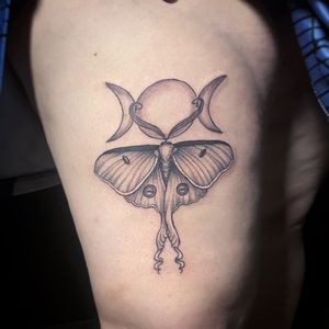 Lunar moth with goddess moon symbol 