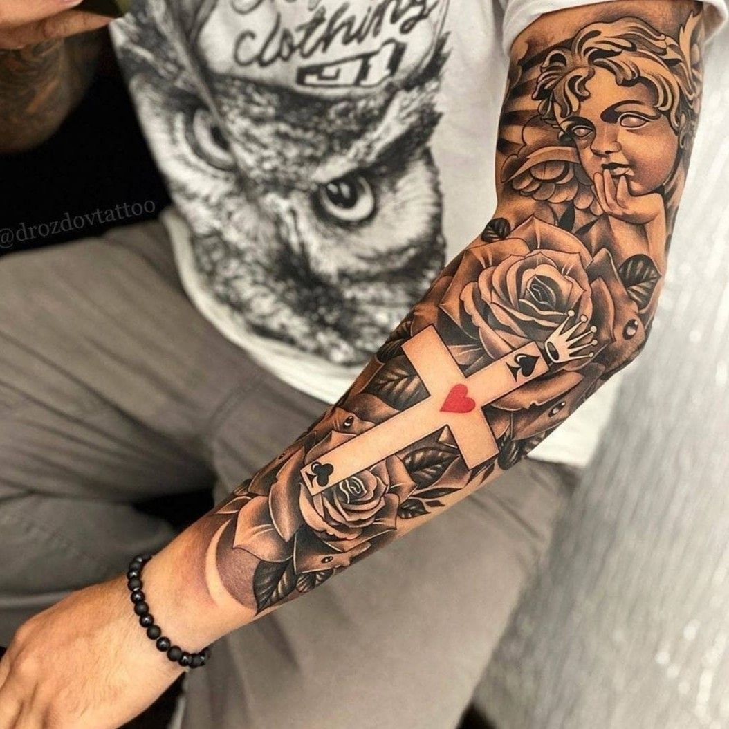 Tattoo uploaded by big lez mate • Full sleeve with negative space cross and  playing card signs. #Ace of spades #Queen of hearts biblical • Tattoodo