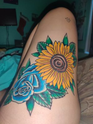 First professionally done tattooimage- yellow sunflower overlaying a blue rose