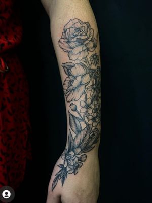 Black work floral design arm and hand