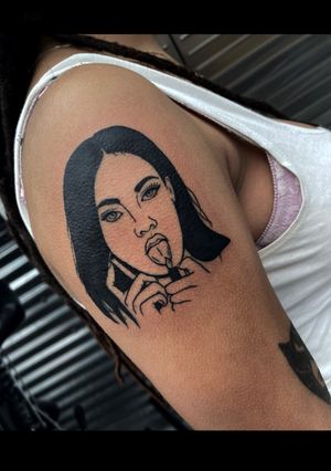 Get a striking upper arm tattoo by Miss Vampira featuring a woman with a cellphone and a lighter in blackwork style.