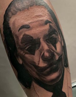 Black and grey joker tattoo