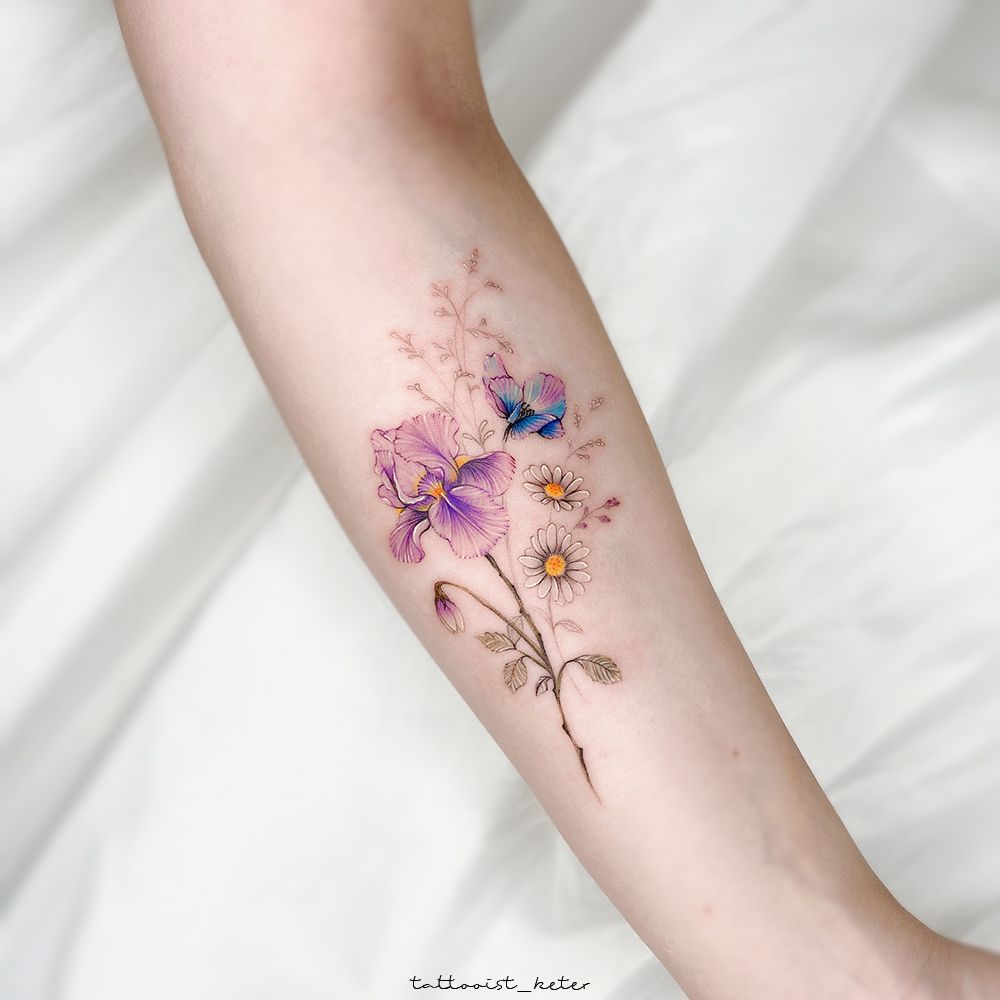 Iris flower tattoo on the left shoulder blade