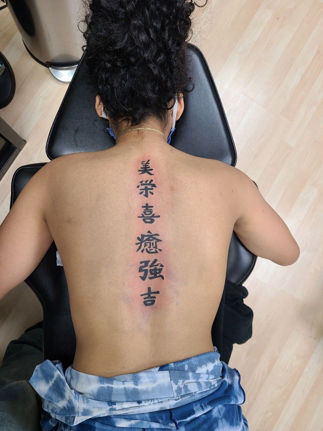 Young female Taiwanese Chinese receiving lower back tattoo from Asian male  with shaved head, Taipei Taiwan Republic of China ROC Stock Photo - Alamy