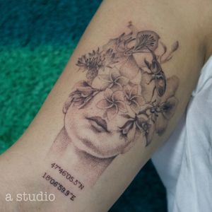 Head with flowers dotwork tattoo 