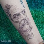 Broken bust of Neptune dotwork tattoo 