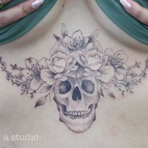 Skull with flowers dotwork tattoo 
