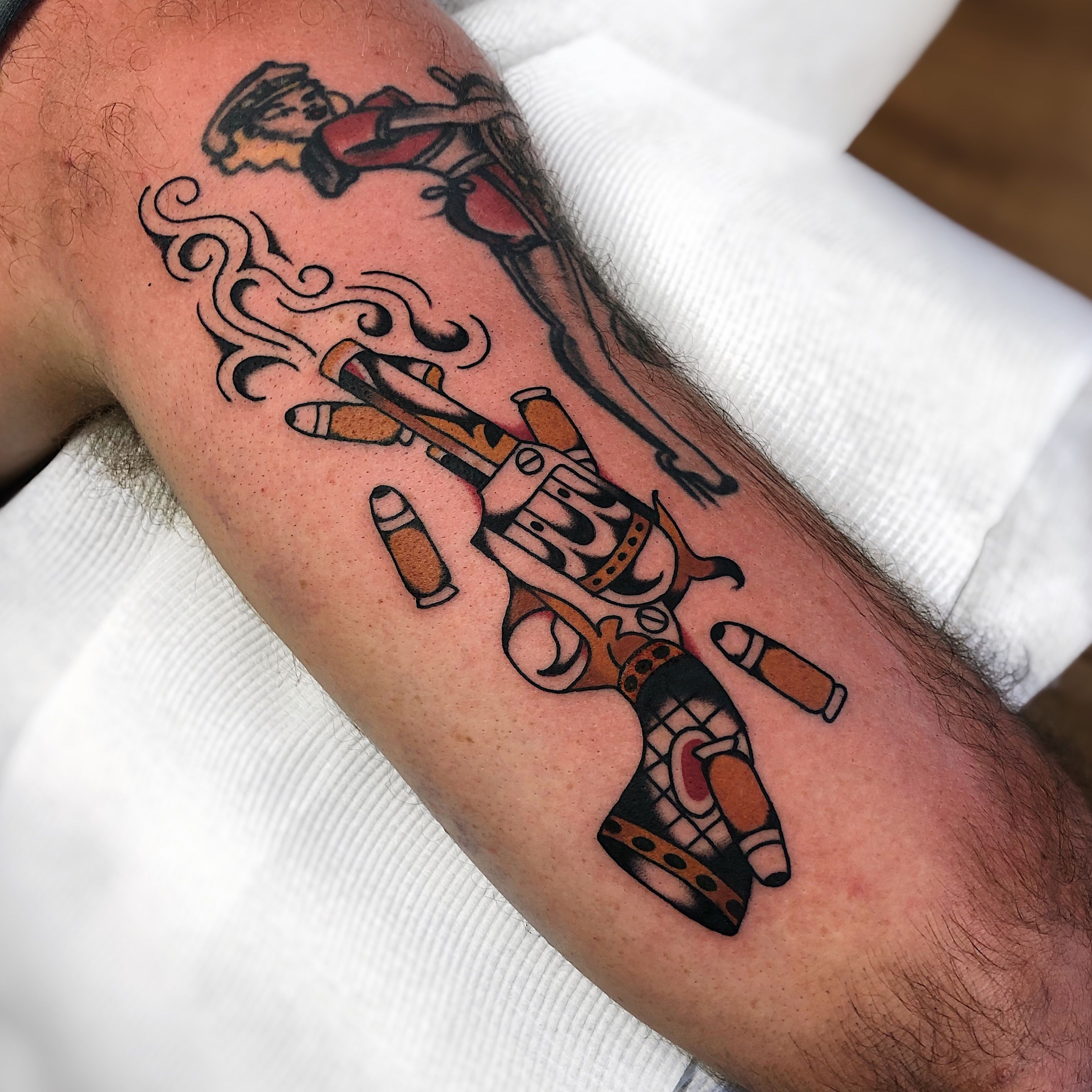 Black revolver tattoo on the arm  Tattoogridnet