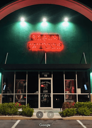 Outside Realm Tattoos Studio (night)